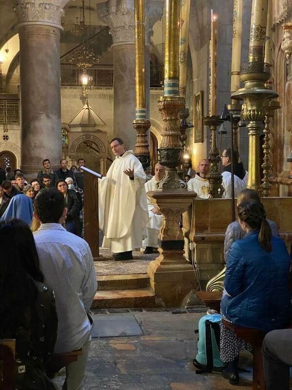 Father Bill Dailey preaching at the Church of the Holy Sepulchre in Jerusalem on pilgrimage with ND students.
