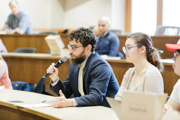 Brett Robinson asks Barba-Kay a question after his lecture.