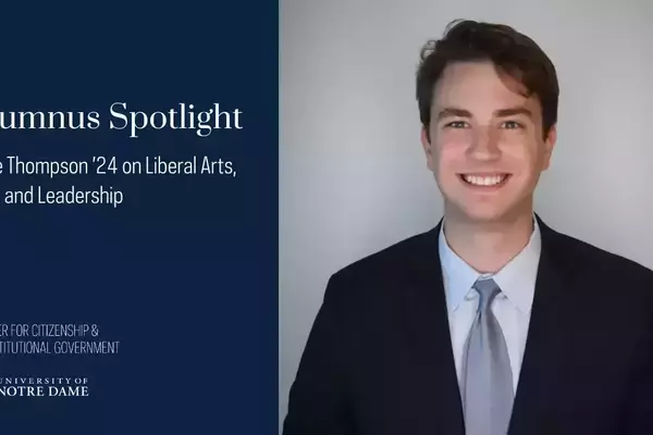 Luke Thompson '24 smiling, wearing a dark suit, light blue shirt, and light gray tie for Alumnus Spotlight.