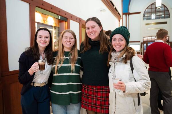 Helena Drake (left) and Lauren Douglas (second from right) enjoy festivities at the 2025 CCCG Christmas party.