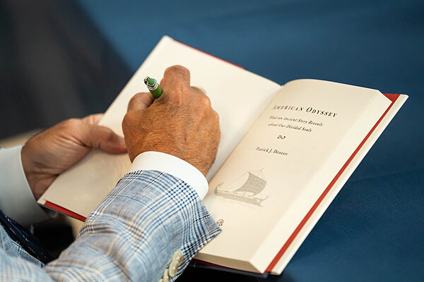 Patrick Deneen signs a student's copy of his new book, American Odyssey.